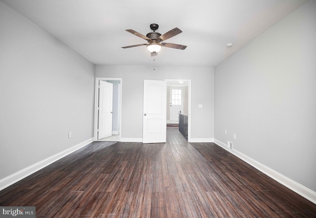 unfurnished bedroom with dark wood-type flooring and ceiling fan