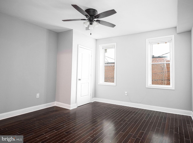 unfurnished room featuring dark hardwood / wood-style floors and ceiling fan