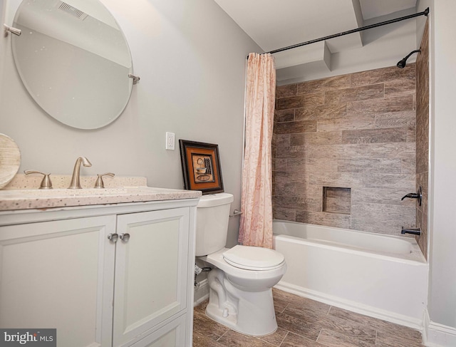 full bathroom featuring shower / bath combo, vanity, and toilet