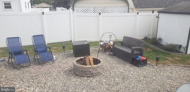 view of yard with a fire pit