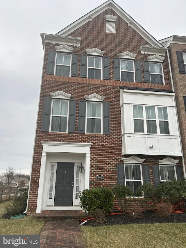 view of front of property featuring brick siding