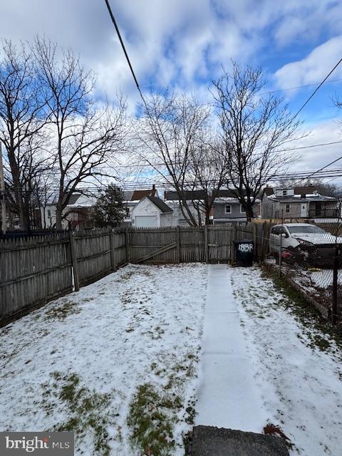 view of yard covered in snow