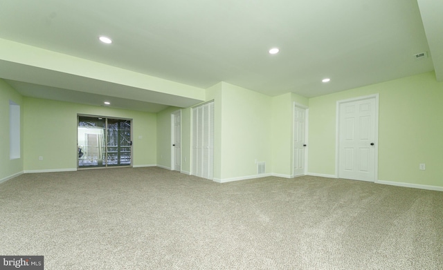 carpeted spare room with visible vents, recessed lighting, and baseboards