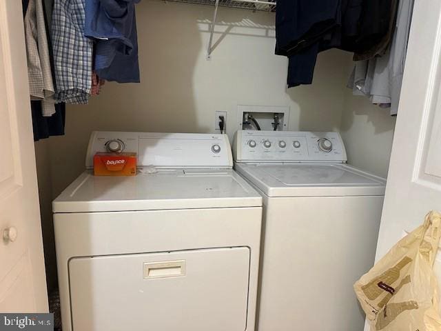 washroom with separate washer and dryer