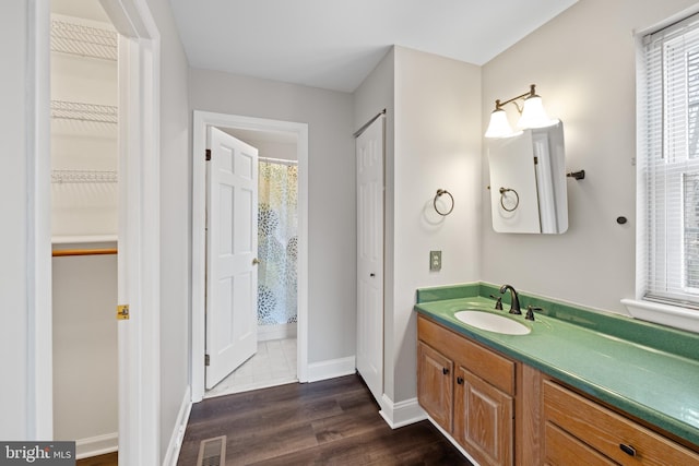 bathroom with vanity and wood-type flooring