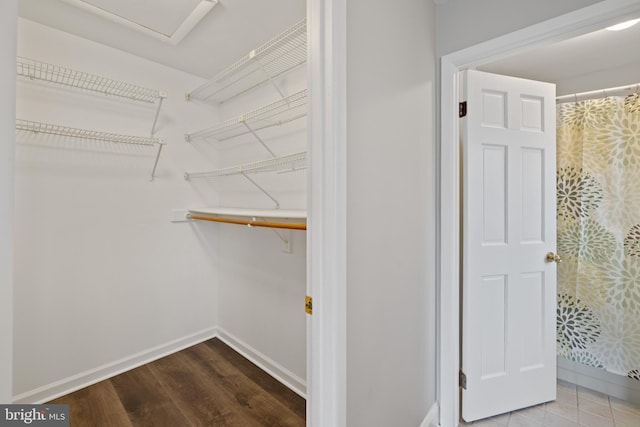 spacious closet featuring hardwood / wood-style floors