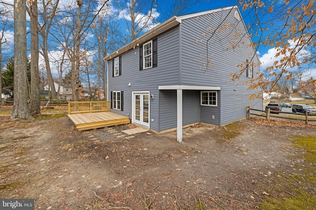 rear view of house featuring french doors and a deck