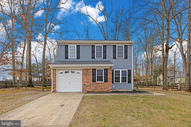 view of front of house with a garage and a front lawn