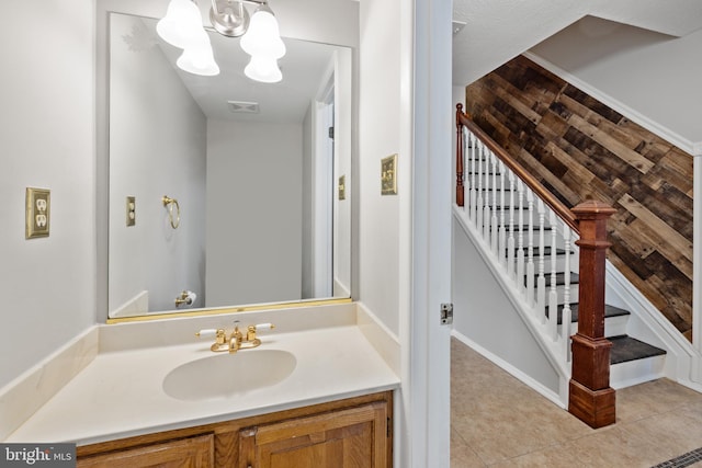 bathroom featuring vanity, tile patterned floors, and an inviting chandelier