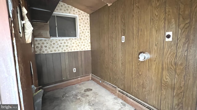 laundry room featuring wooden walls