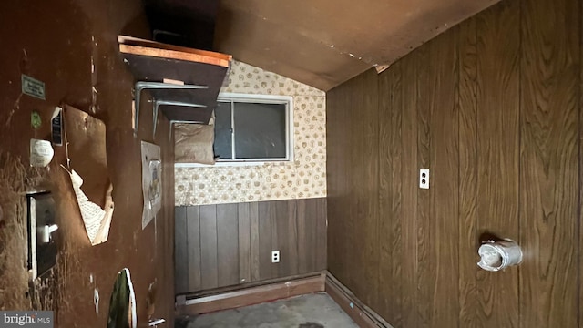 washroom featuring wooden walls