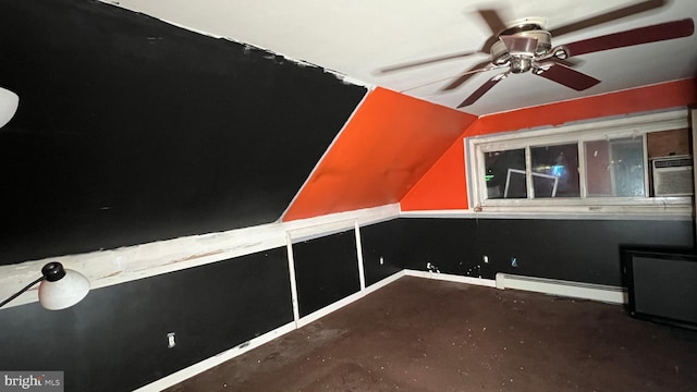 bonus room with ceiling fan, vaulted ceiling, and a baseboard heating unit