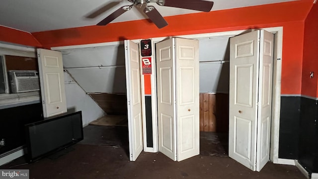 bedroom featuring cooling unit, ceiling fan, and a baseboard heating unit