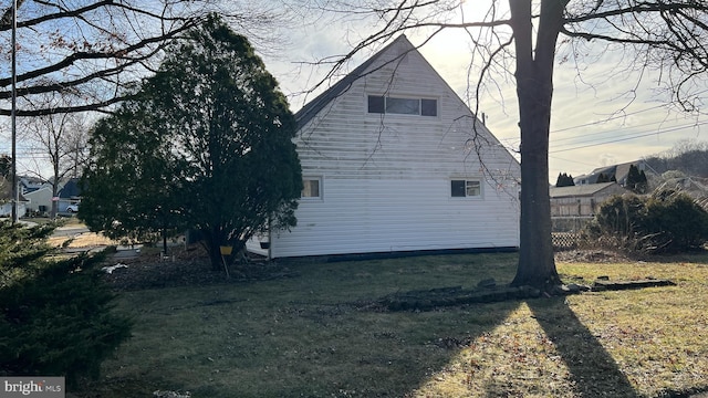 view of home's exterior featuring a yard