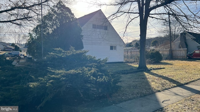 view of home's exterior featuring a lawn