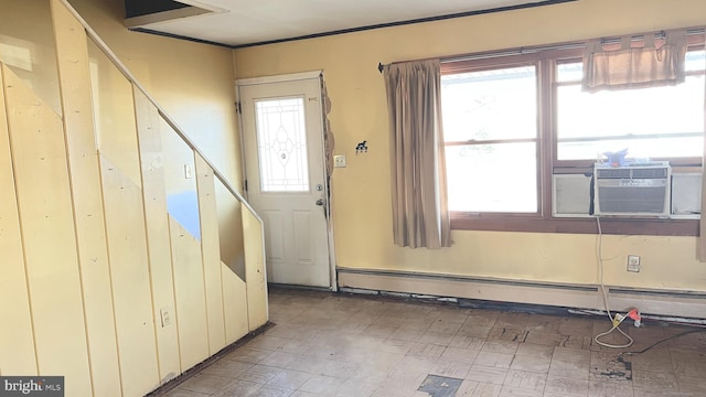 foyer featuring cooling unit and a baseboard heating unit