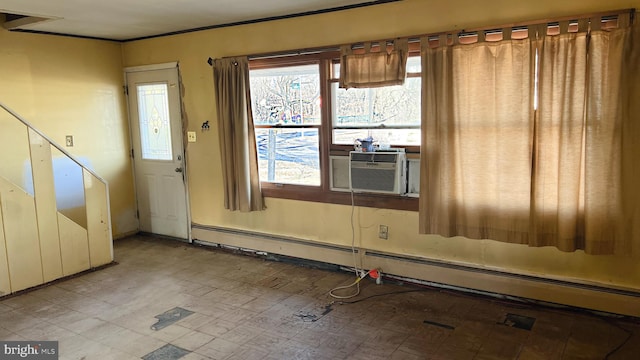 unfurnished room featuring cooling unit and a baseboard radiator