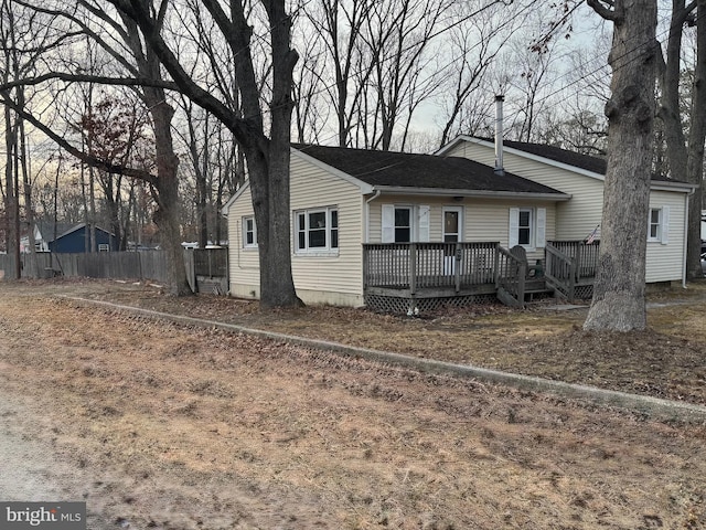 rear view of property with a deck