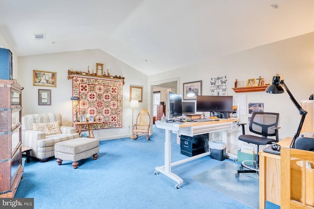 carpeted office featuring vaulted ceiling