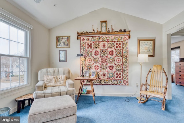 sitting room with vaulted ceiling and carpet