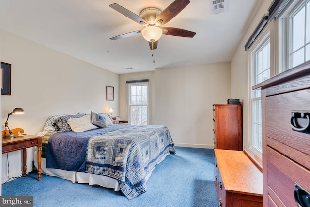 carpeted bedroom with ceiling fan