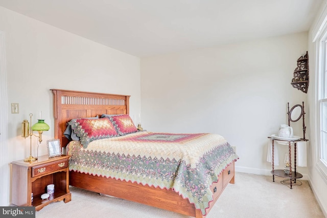 bedroom with light carpet