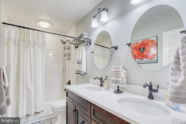 full bathroom featuring vanity, shower / bath combination with curtain, and toilet