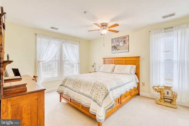 bedroom featuring light carpet and ceiling fan