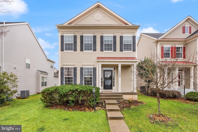 view of front of house featuring central AC and a front lawn