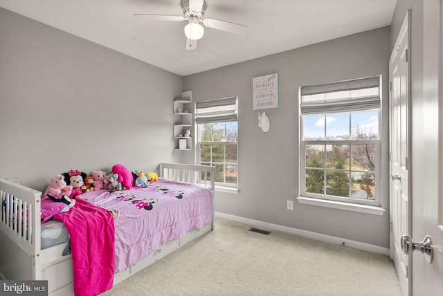 carpeted bedroom featuring ceiling fan