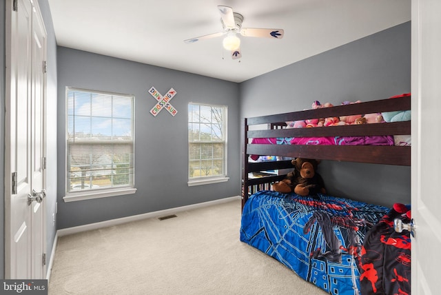 carpeted bedroom with ceiling fan