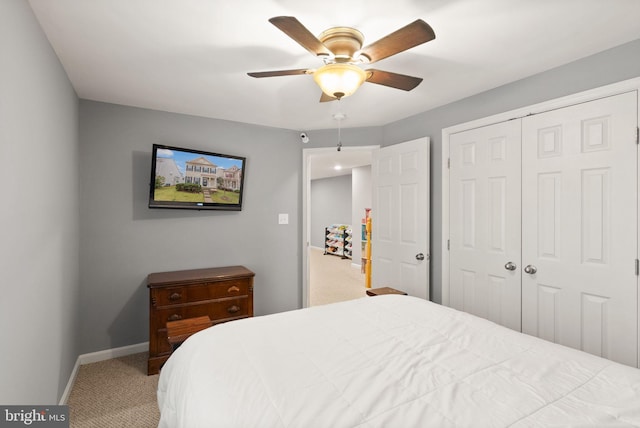 bedroom with carpet floors, ceiling fan, and a closet