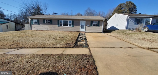 ranch-style home with a front lawn