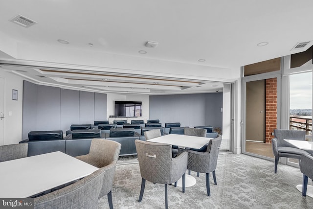 dining room with light colored carpet