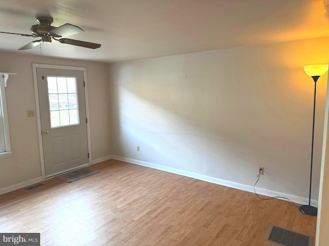 interior space featuring wood-type flooring and ceiling fan