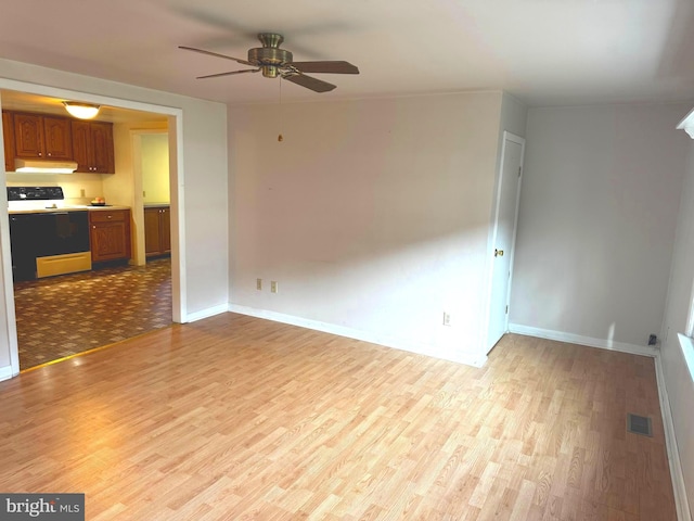 unfurnished living room with ceiling fan and light wood-type flooring