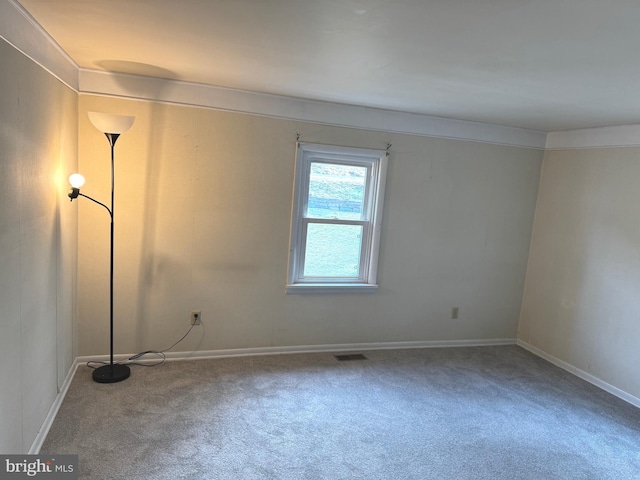 empty room featuring carpet flooring