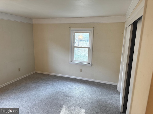 unfurnished room with carpet flooring