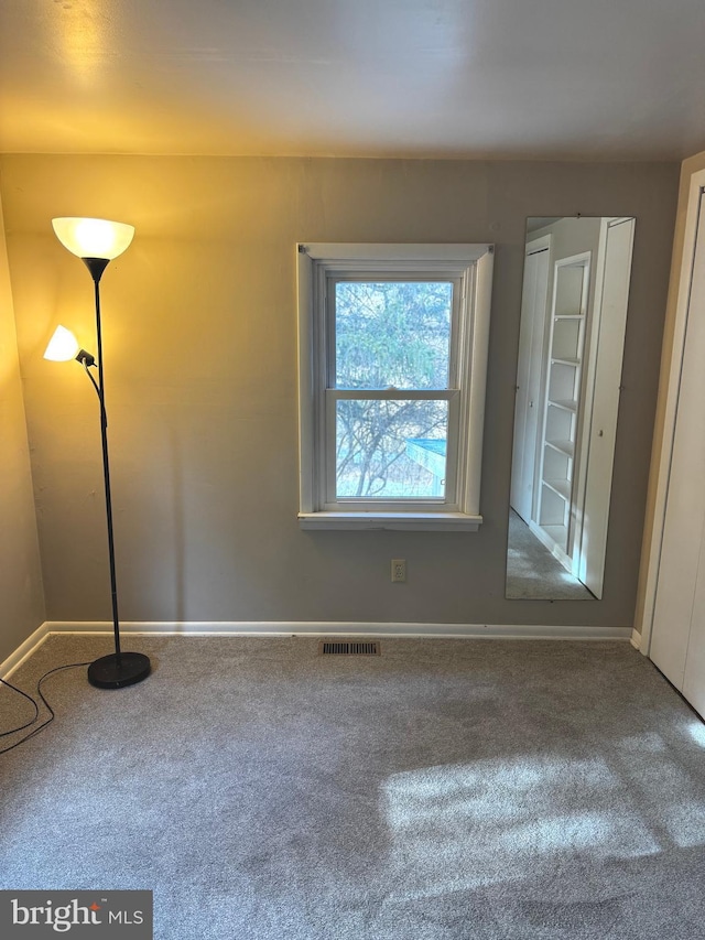 empty room with carpet floors