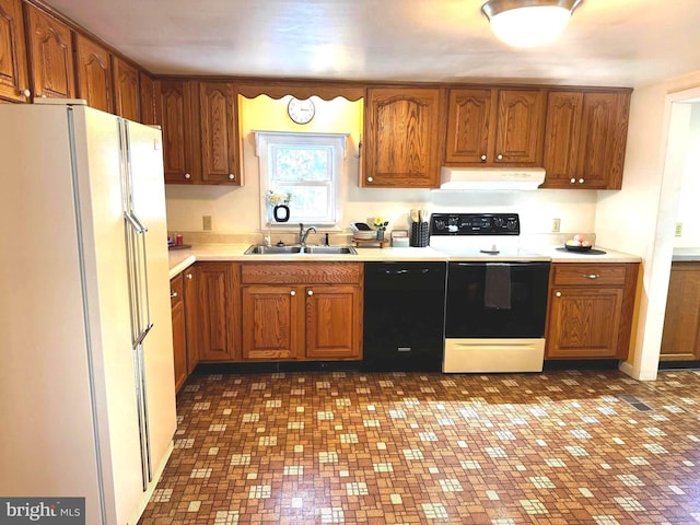 kitchen with white fridge, sink, black dishwasher, and electric stove