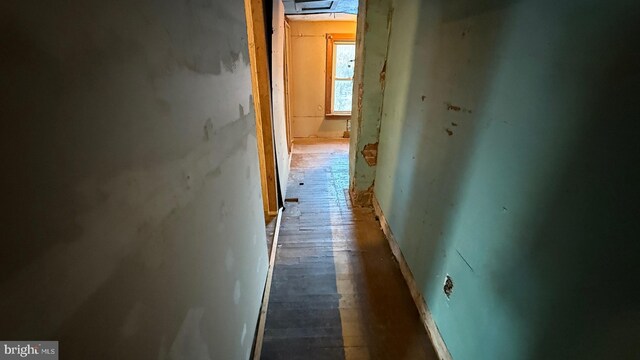 corridor featuring dark wood-style flooring