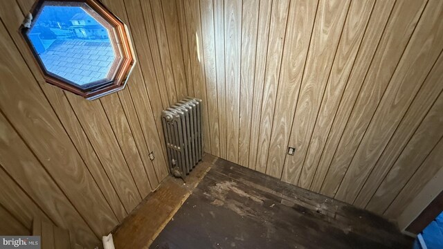 details with wood walls and radiator heating unit