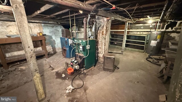 unfinished basement featuring water heater and a heating unit