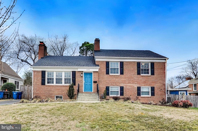 tri-level home featuring a front lawn