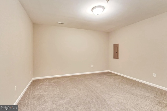 unfurnished room featuring carpet flooring and electric panel