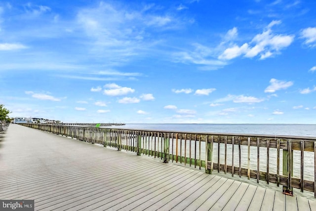 dock area with a view of the beach and a water view