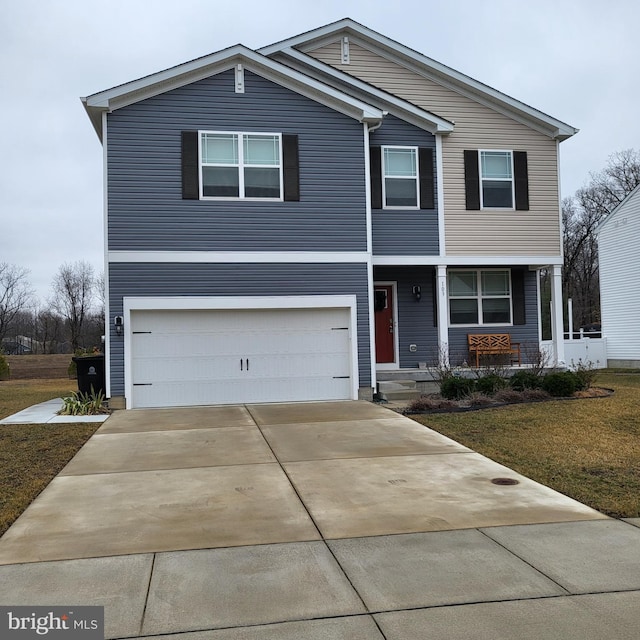 view of front of house featuring concrete driveway, a front lawn, and an attached garage