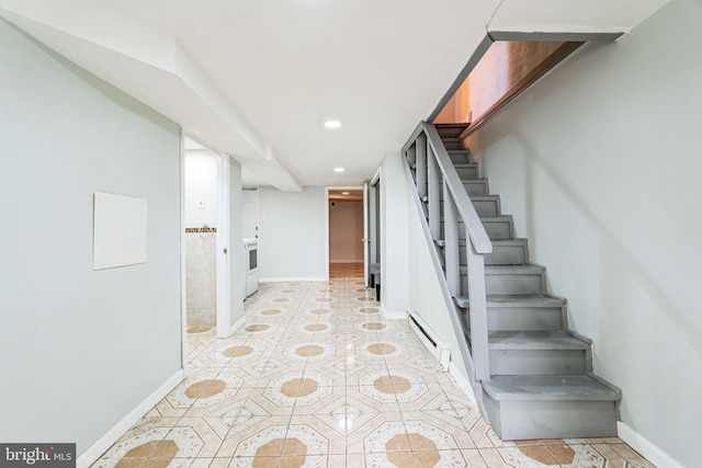 stairs with baseboard heating and tile patterned floors