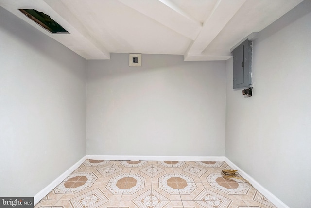 basement featuring electric panel and light tile patterned flooring