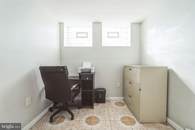 office area featuring light tile patterned flooring and a healthy amount of sunlight